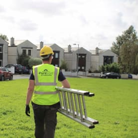 Purevolt Solar staff member holding a ladder