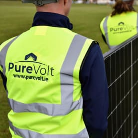Solar Panel Installers carrying solar panels